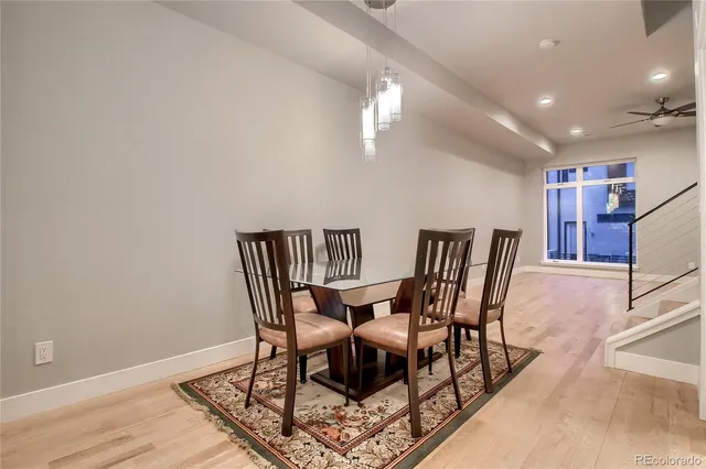 an empty room with fan and entrance