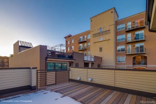 a view of buildings from the balcony