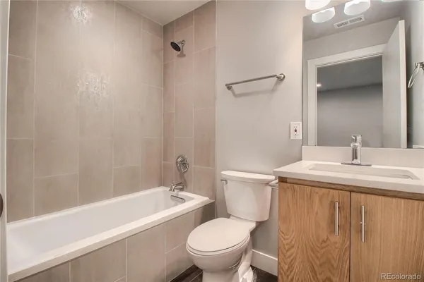 a bathroom with a sink a toilet and a bathtub