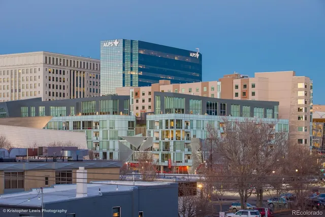 a front view of a building with glass windows and entertaining space