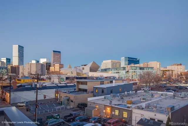 a view of an empty room with a ceiling fan