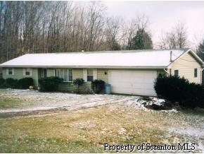 8246 Griffin Road Moscow, PA 18444 - Photo 1 of 1 a view of a house with backyard and sitting area