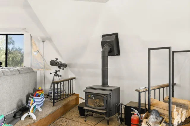 a bedroom with a bed and flat screen tv