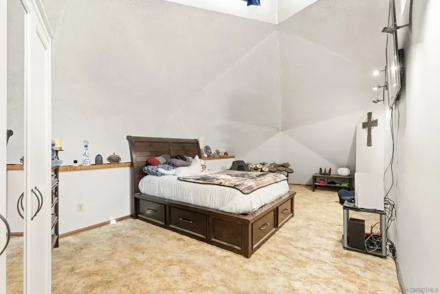 a living room with lots of furniture and a book shelf