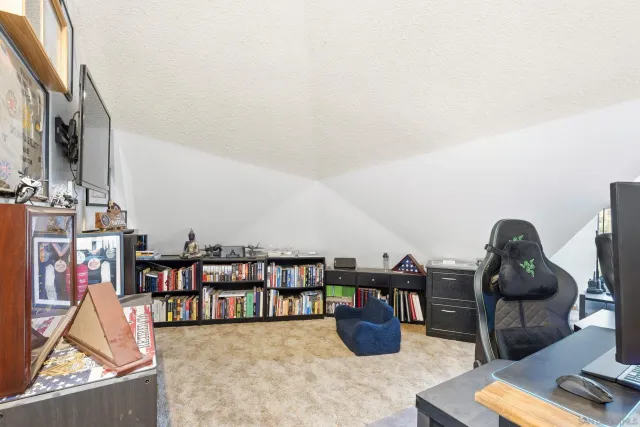 a room with lots of furniture and white walls