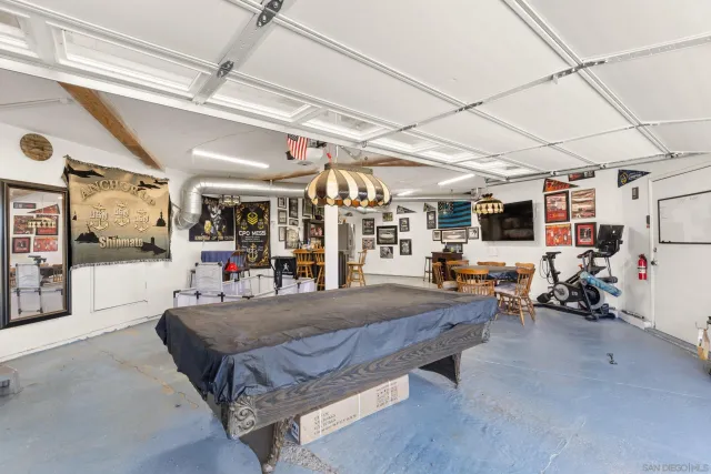 a view of a garage with a bike and car