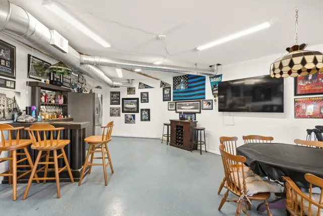 a view of balcony with wooden floor and outdoor seating