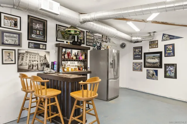 a view of a balcony with wooden floor and fence