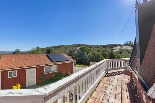 a view of a backyard with table and chairs and fire pit