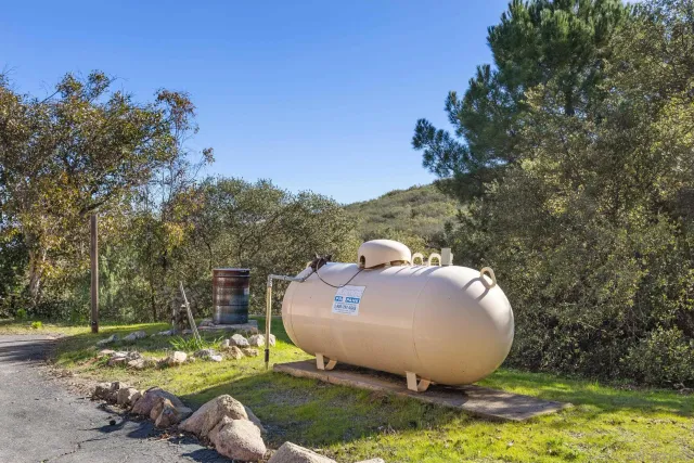 a view of a field with an trees