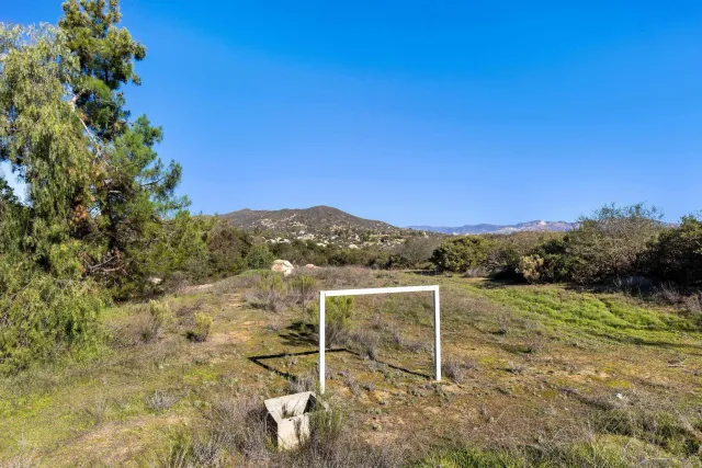 an aerial view of mountain with parking space