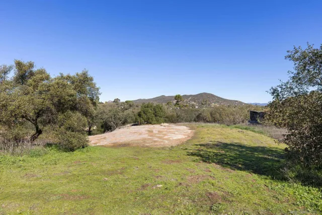 an aerial view of residential house with outdoor space and swimming pool