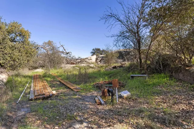 an aerial view of a house with a mountain