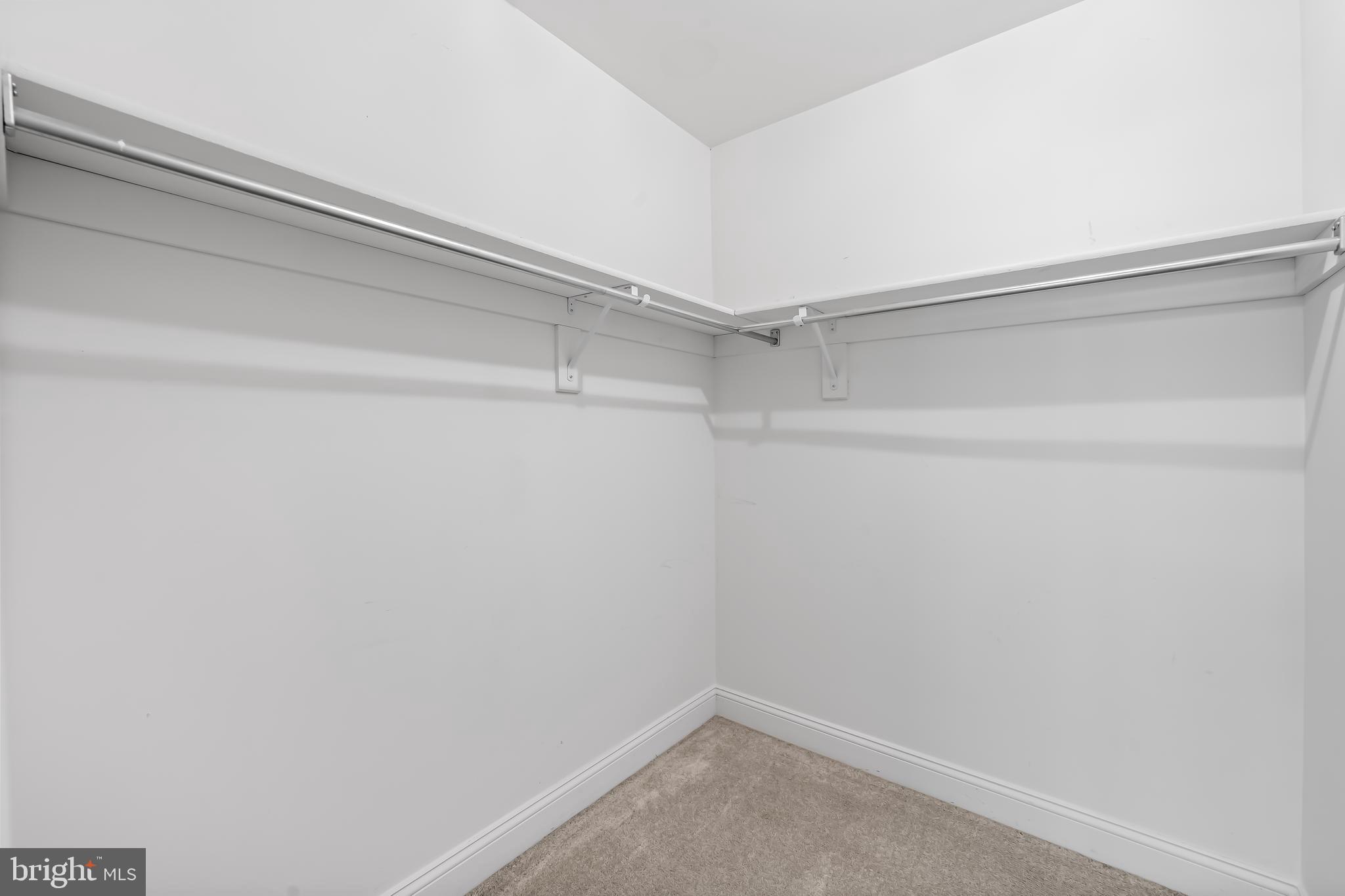 24 Roland Green, Unit 12 Baltimore, MD 21210 - Photo 36 of 53 a view of a room with racks on the wall