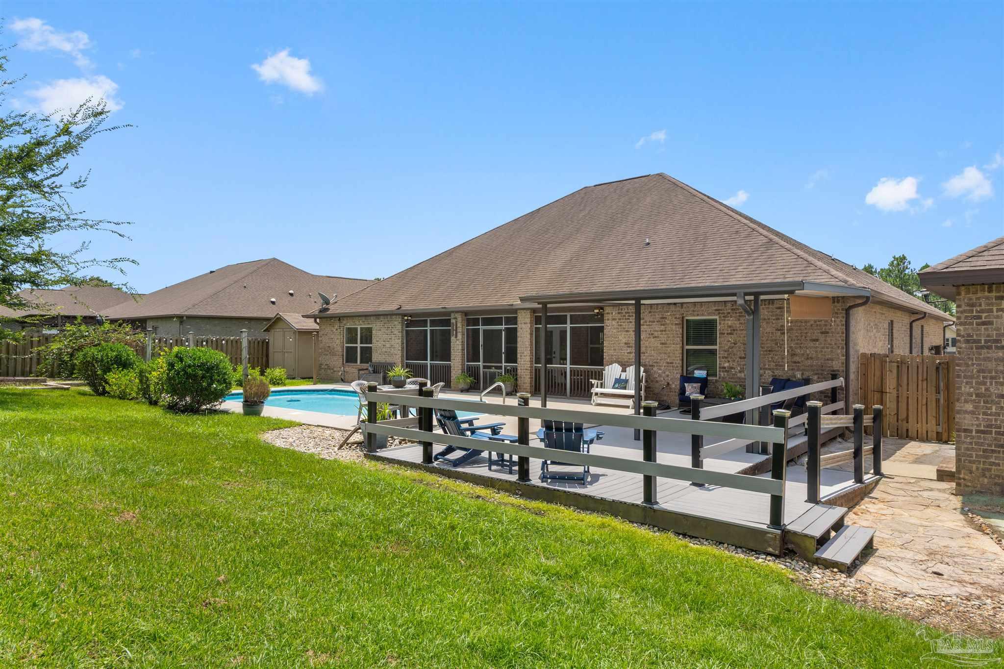 2698 Tulip Hill Road Pace, FL 32571 - Photo 62 of 65 a view of a house with patio