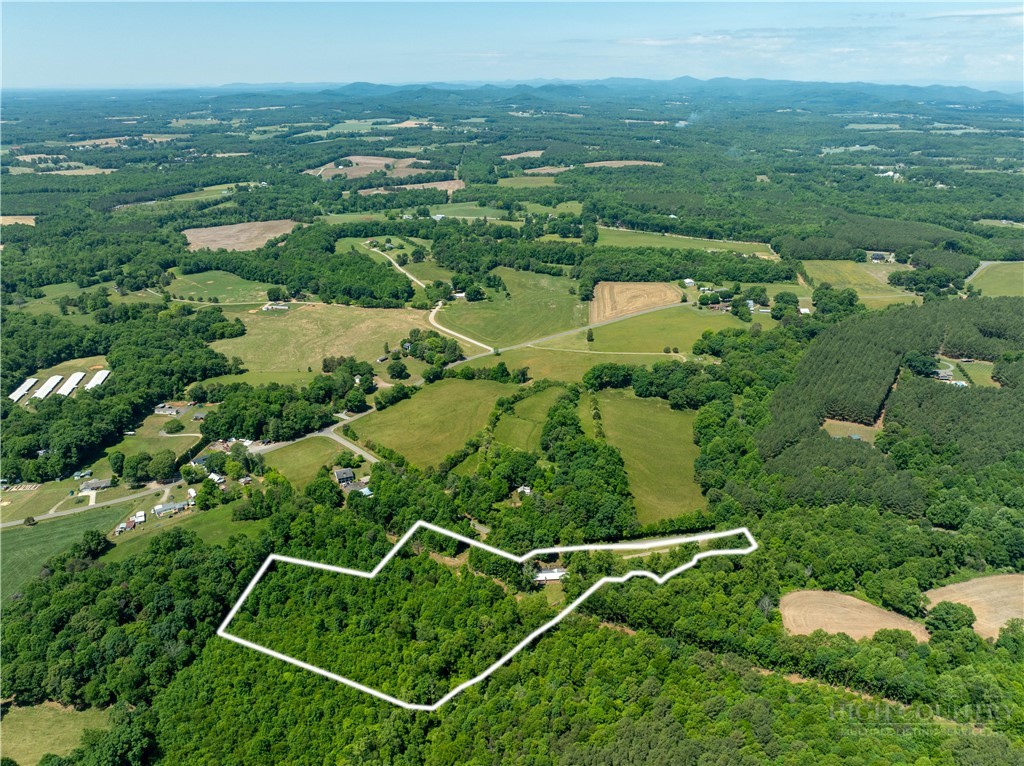 142 Pioneer Road Harmony, NC 28634 - Photo 15 of 49 an aerial view of residential houses with outdoor space and trees