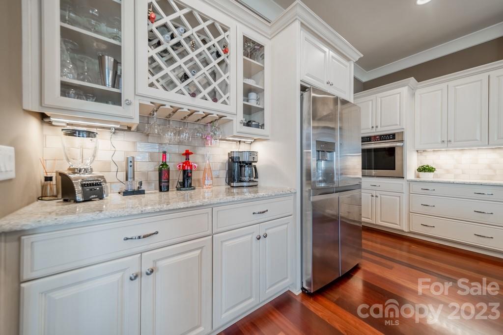 218 Queens Cove Road Mooresville, NC 28117 - Photo 14 of 42 a kitchen with stainless steel appliances granite countertop a refrigerator and a stove