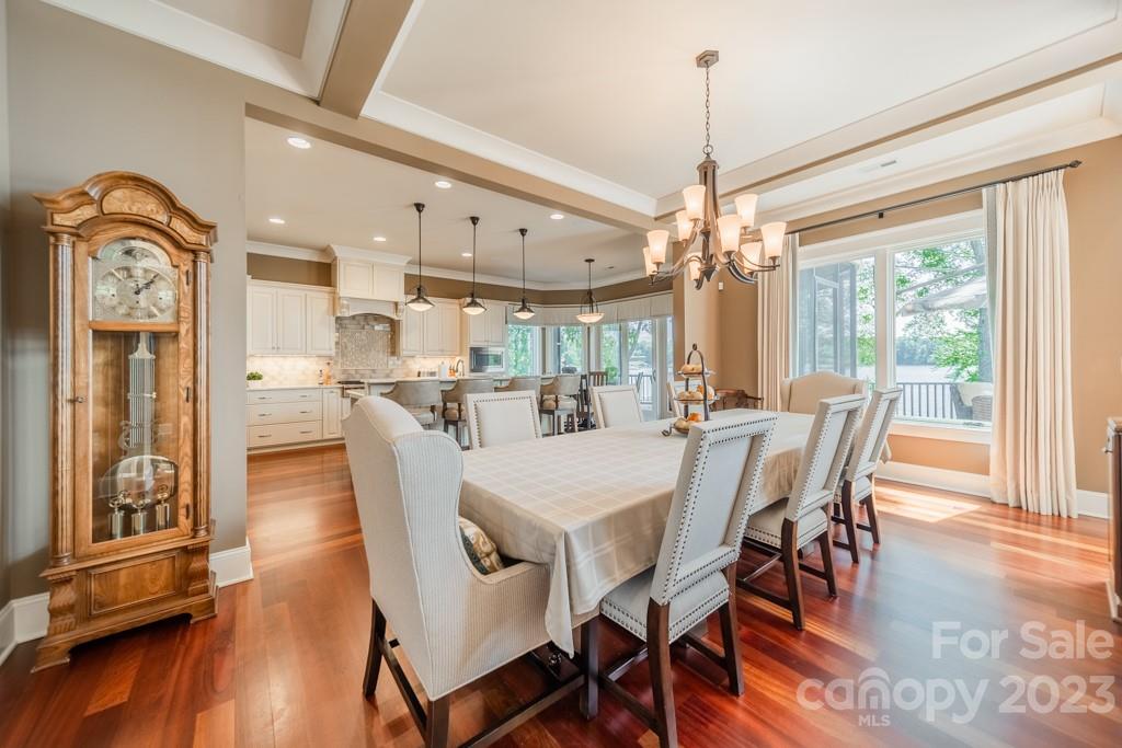 218 Queens Cove Road Mooresville, NC 28117 - Photo 15 of 42 a dining room with furniture window wooden floor