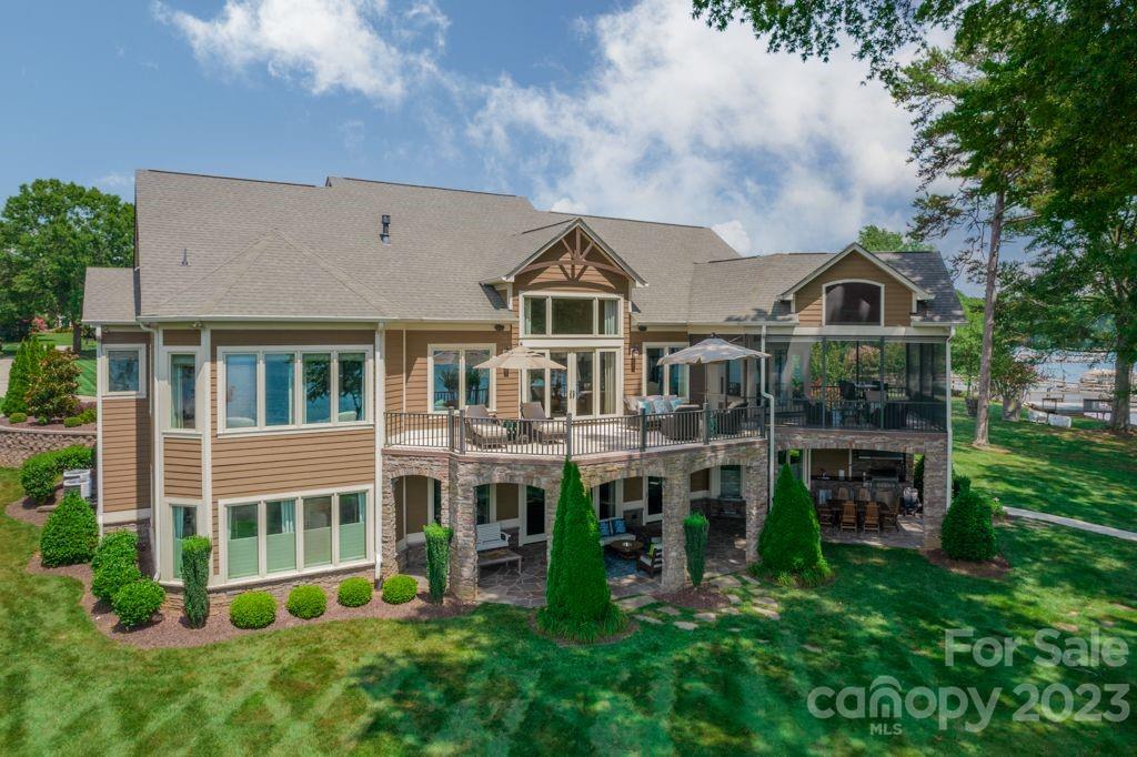 218 Queens Cove Road Mooresville, NC 28117 - Photo 2 of 42 a view of a house with a big yard and large trees