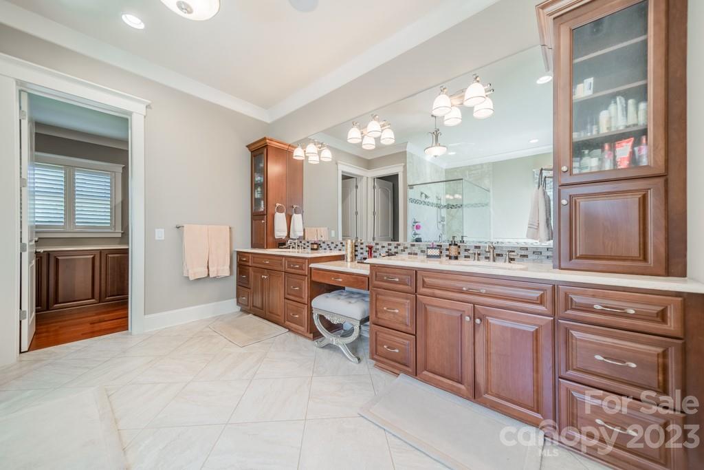 218 Queens Cove Road Mooresville, NC 28117 - Photo 23 of 42 a large bathroom with a large tub and sink