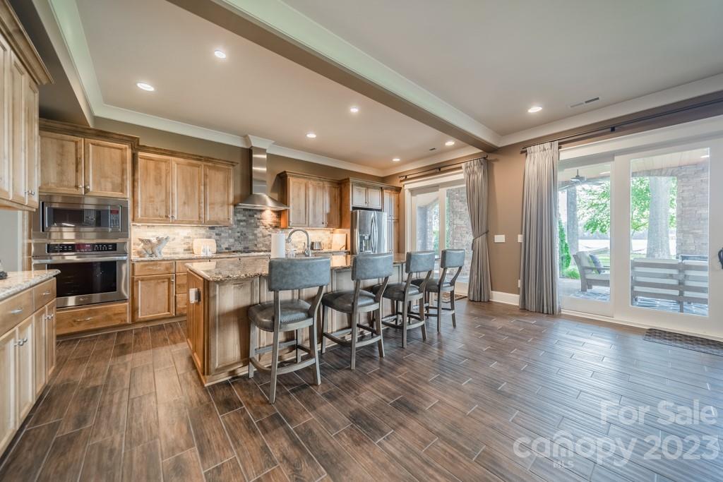 218 Queens Cove Road Mooresville, NC 28117 - Photo 25 of 42 a view of a dining room with furniture window and wooden floor