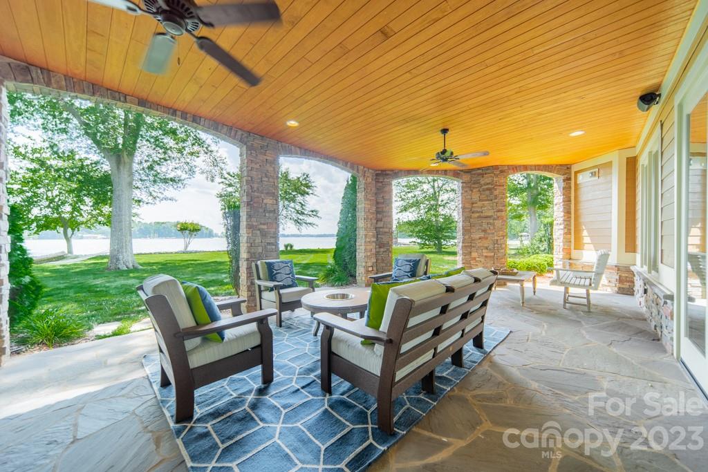 218 Queens Cove Road Mooresville, NC 28117 - Photo 28 of 42 a living room with patio furniture and garden