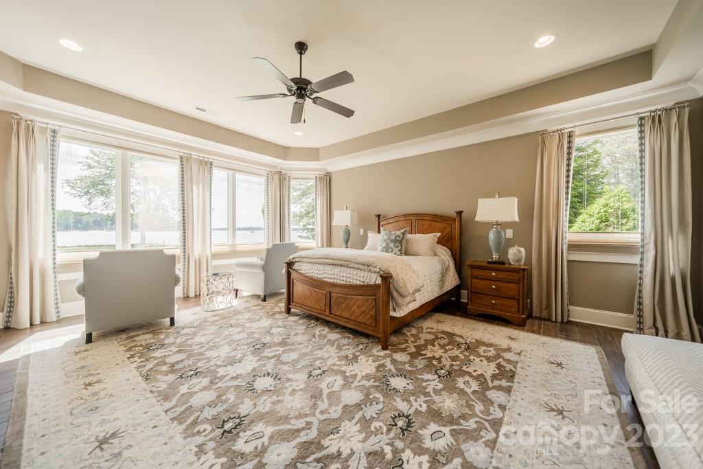 218 Queens Cove Road Mooresville, NC 28117 - Photo 32 of 42 a bedroom with a large bed and a window