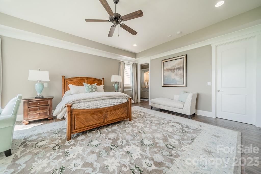 218 Queens Cove Road Mooresville, NC 28117 - Photo 34 of 42 a bedroom with a bed and a couch