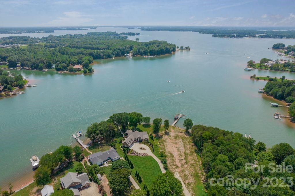 218 Queens Cove Road Mooresville, NC 28117 - Photo 4 of 42 an aerial view of a house with a lake view
