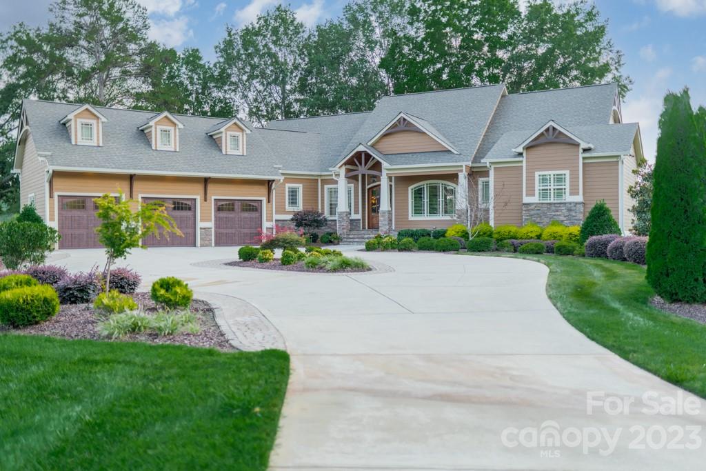 218 Queens Cove Road Mooresville, NC 28117 - Photo 42 of 42 a front view of a house with a yard and potted plants