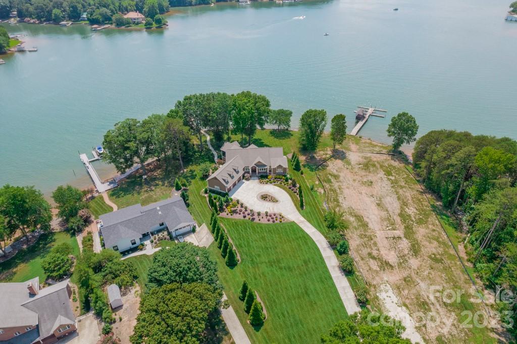 218 Queens Cove Road Mooresville, NC 28117 - Photo 5 of 42 an aerial view of a house with a yard and lake view
