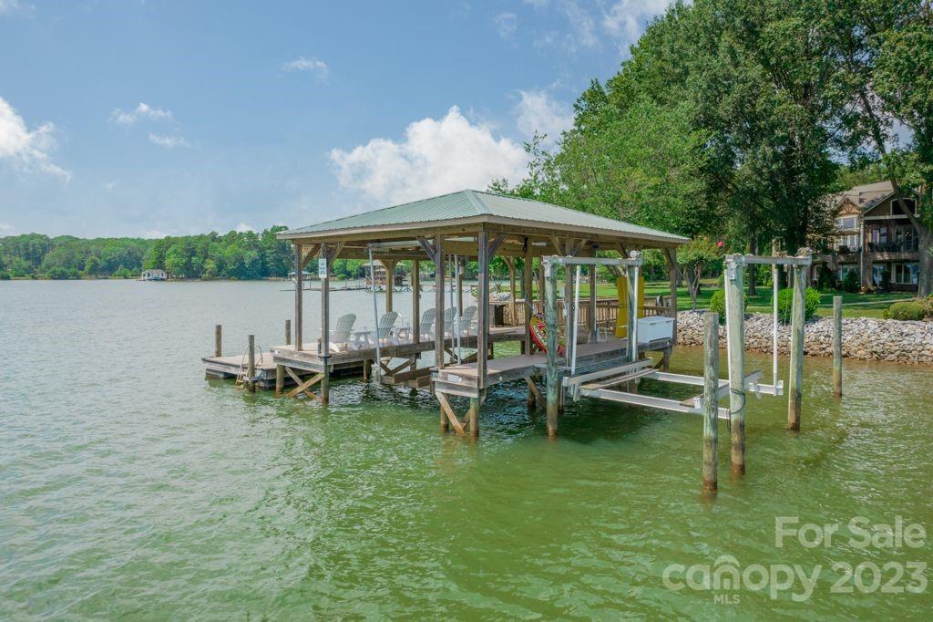 218 Queens Cove Road Mooresville, NC 28117 - Photo 8 of 42 a view of a lake with outdoor seating