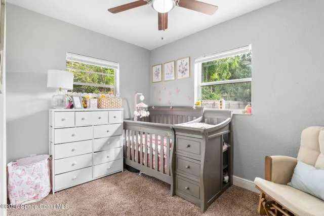 a bed room with a bed and a window