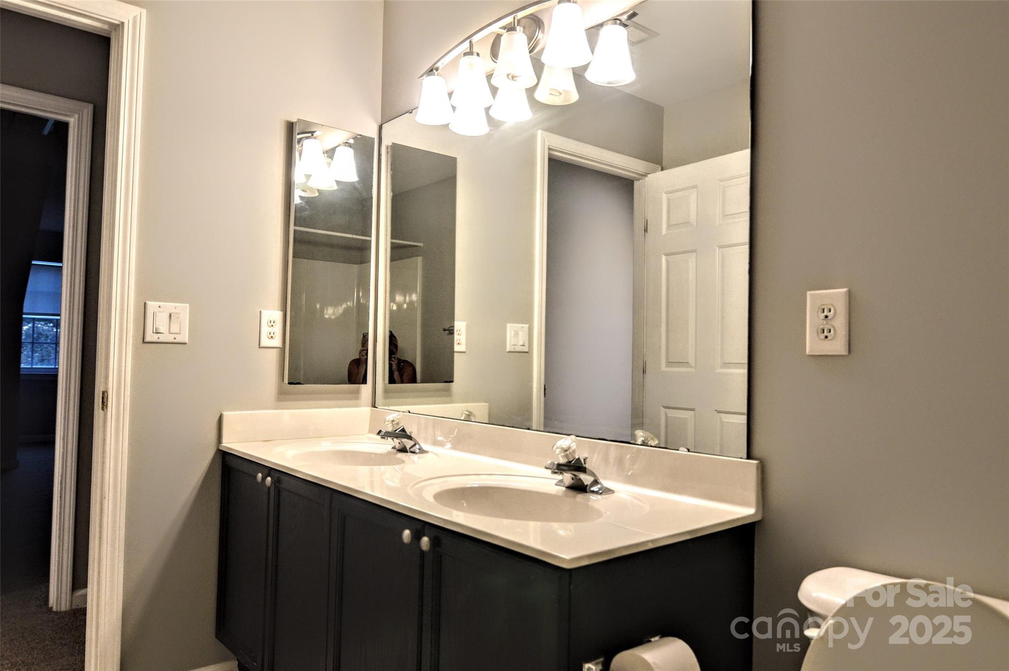 2035 Hollyhedge Lane Indian Trail, NC 28079 - Photo 24 of 32 a bathroom with a sink and a mirror