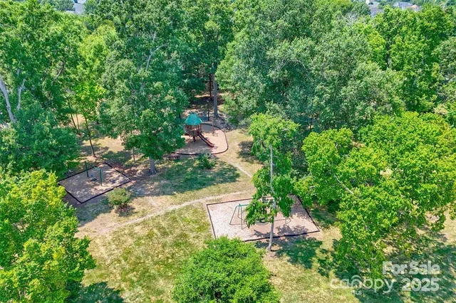 a view of a house with a yard and plants