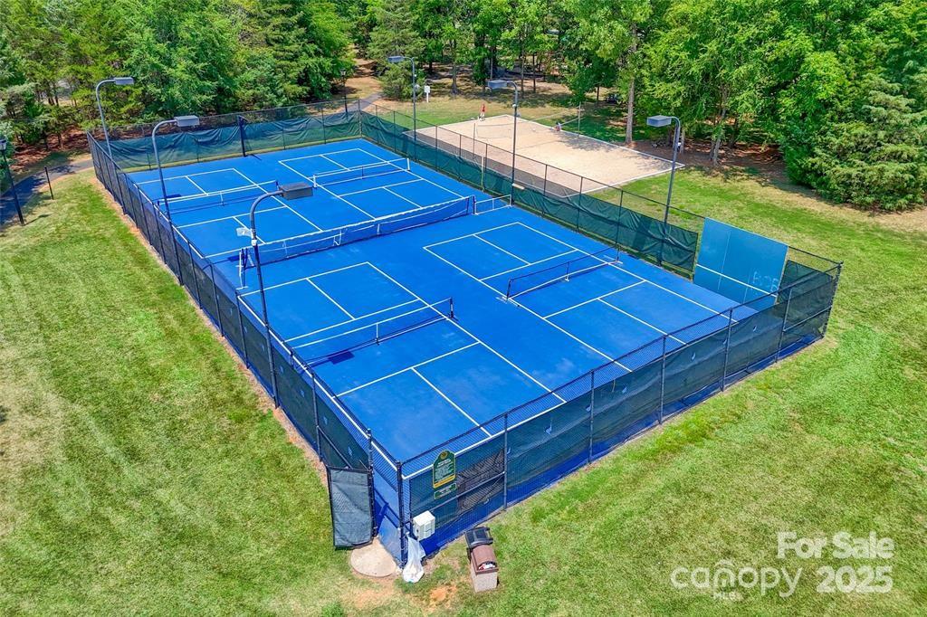 2035 Hollyhedge Lane Indian Trail, NC 28079 - Photo 32 of 32 a view of a tennis ground with a wooden deck