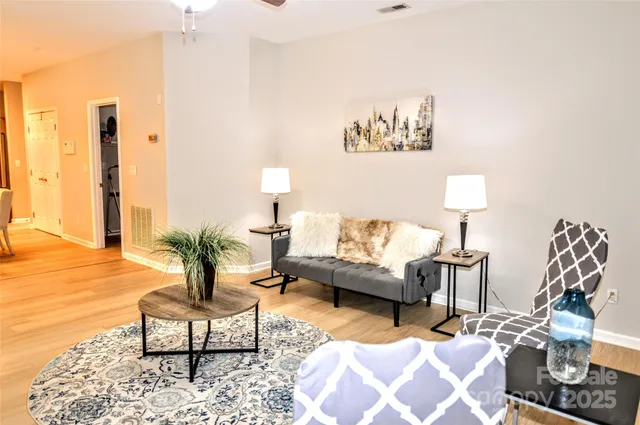 a living room with furniture and a lamp