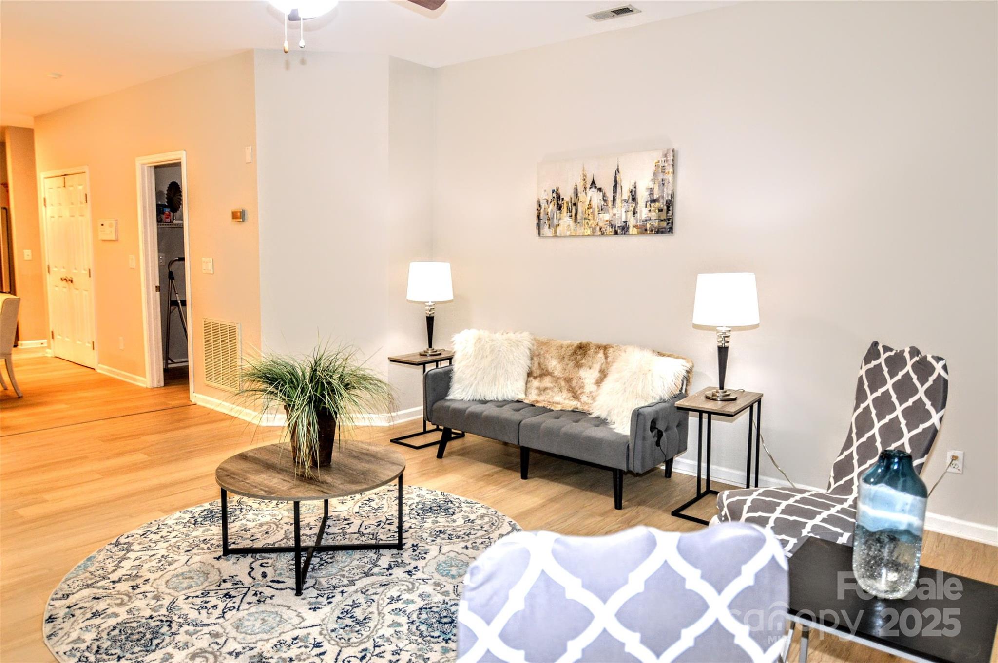 2035 Hollyhedge Lane Indian Trail, NC 28079 - Photo 10 of 32 a living room with furniture and a lamp