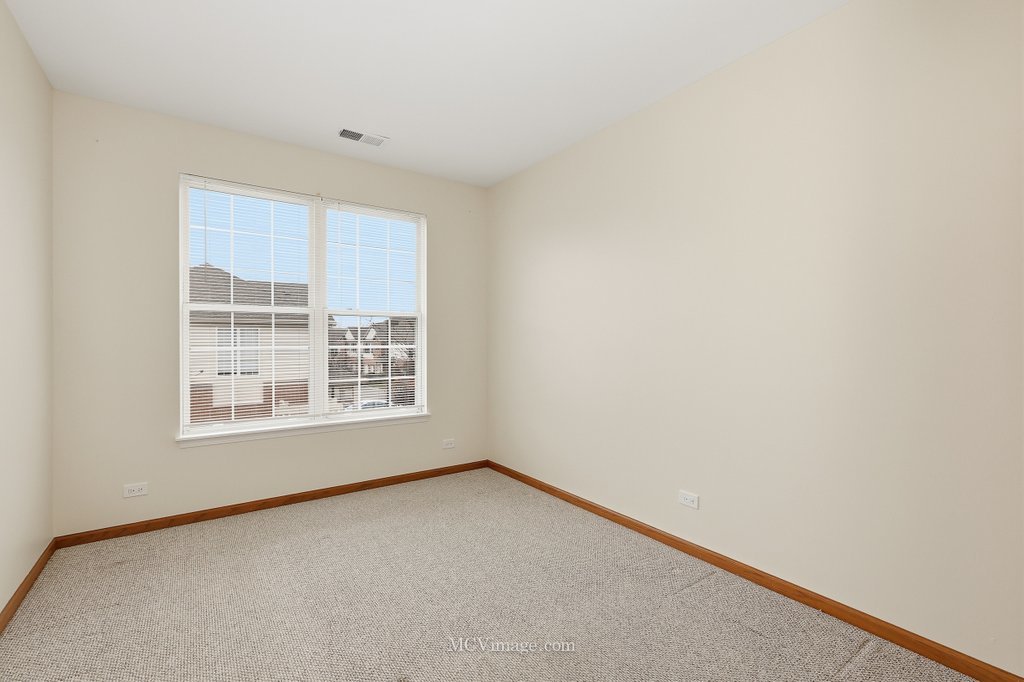 9017 Concord Lane, Unit L Justice, IL 60458 - Photo 15 of 20 a view of an empty room with a window