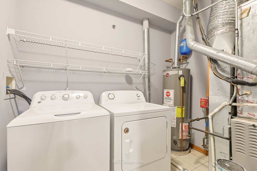 9017 Concord Lane, Unit L Justice, IL 60458 - Photo 18 of 20 a utility room with dryer and washer