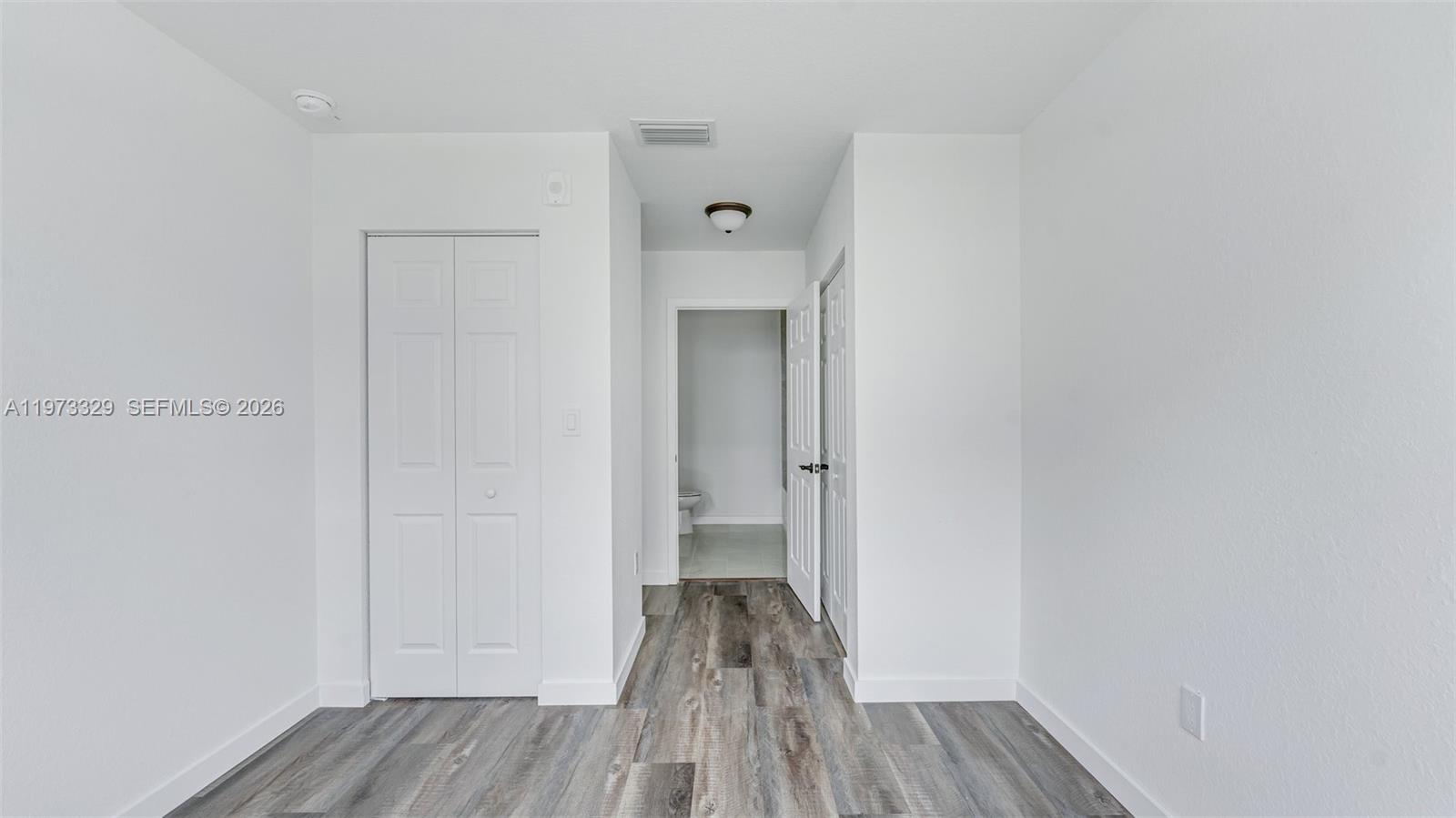 13375 Southwest 250th Street, Unit 104 Homestead, FL 33032 - Photo 13 of 27 a view of a room with wooden floor and a sink