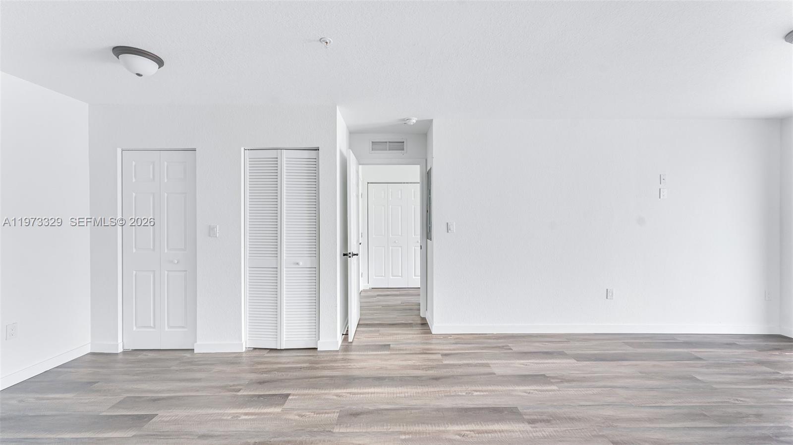 13375 Southwest 250th Street, Unit 104 Homestead, FL 33032 - Photo 10 of 27 a view of a livingroom with wooden floor