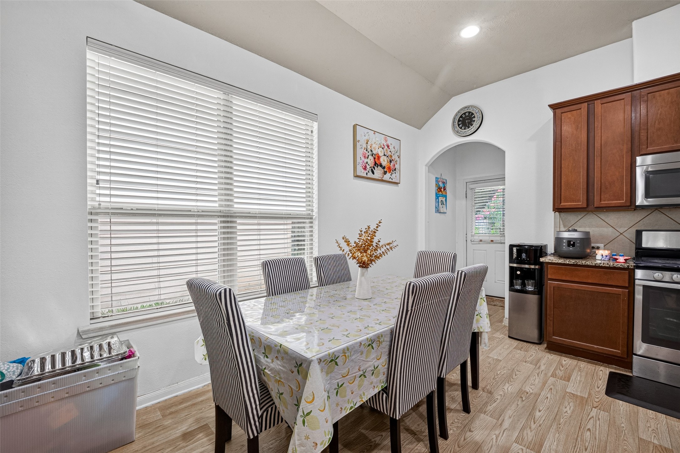 9314 Fuqua Ridge Lane Houston, TX 77075 - Photo 8 of 24 a view of a dining room with furniture and wooden floor