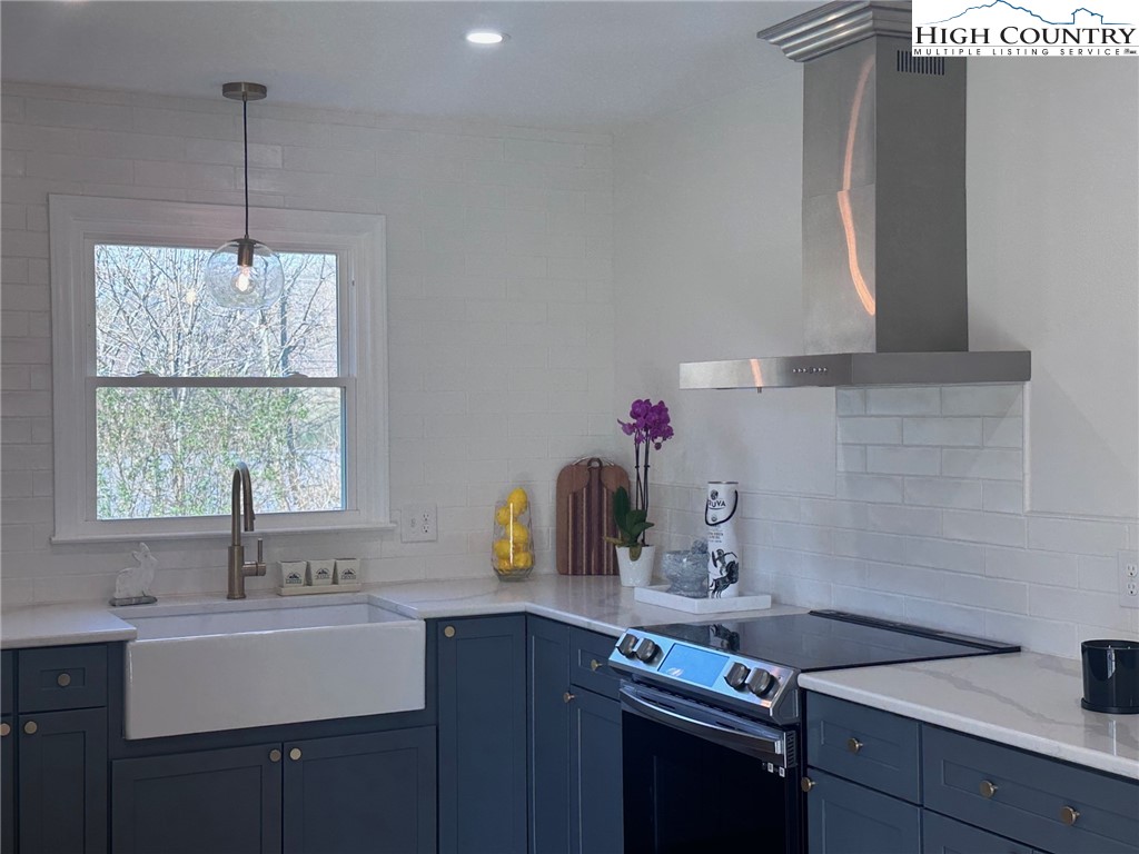 410 Cook Street Jefferson, NC 28640 - Photo 5 of 16 a kitchen with a sink cabinets and window
