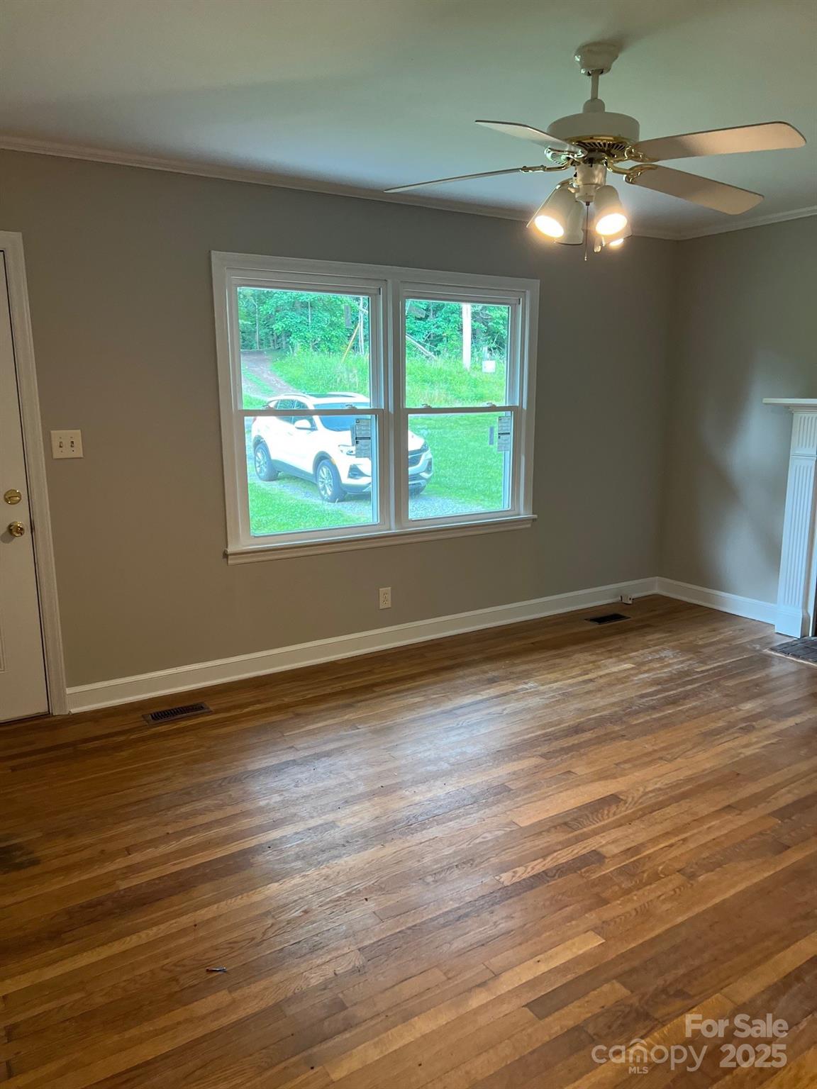 755 Victory Grove Church Road Lincolnton, NC 28092 - Photo 4 of 9 an empty room with wooden floor and windows