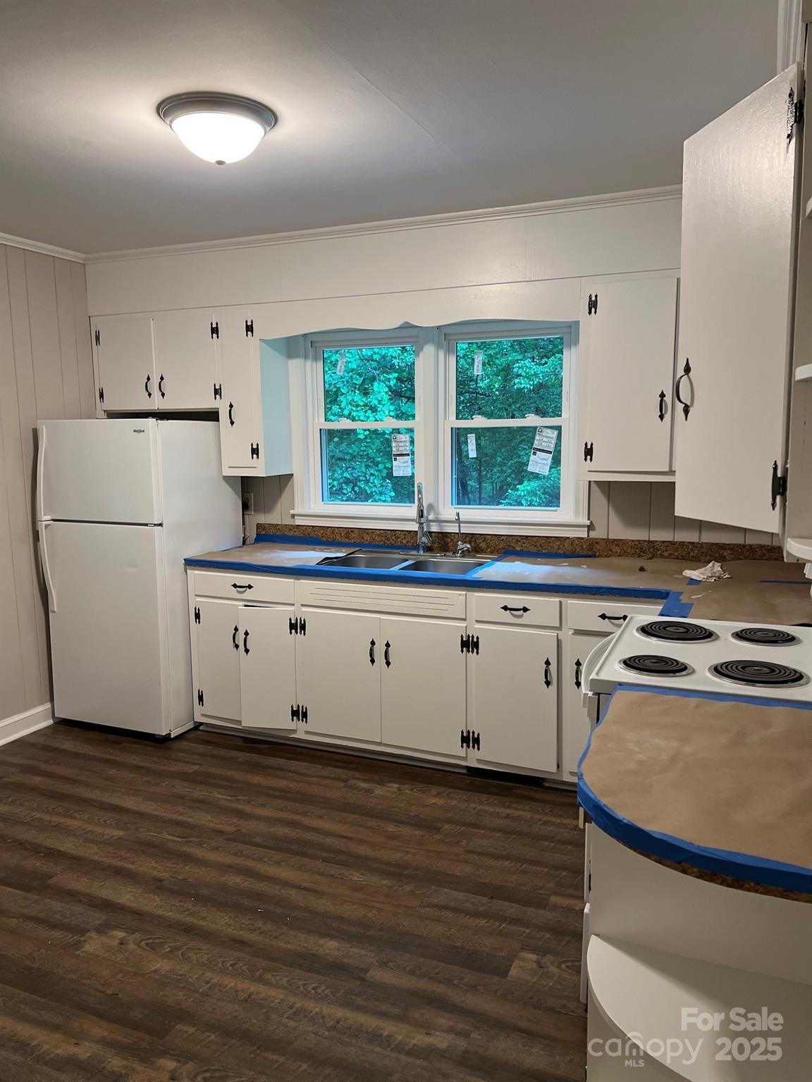755 Victory Grove Church Road Lincolnton, NC 28092 - Photo 5 of 9 a kitchen with granite countertop white cabinets and white appliances