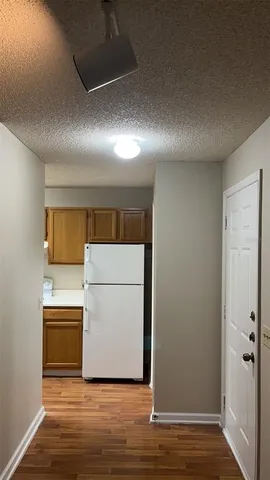 a view of washer and dryer with wooden floor