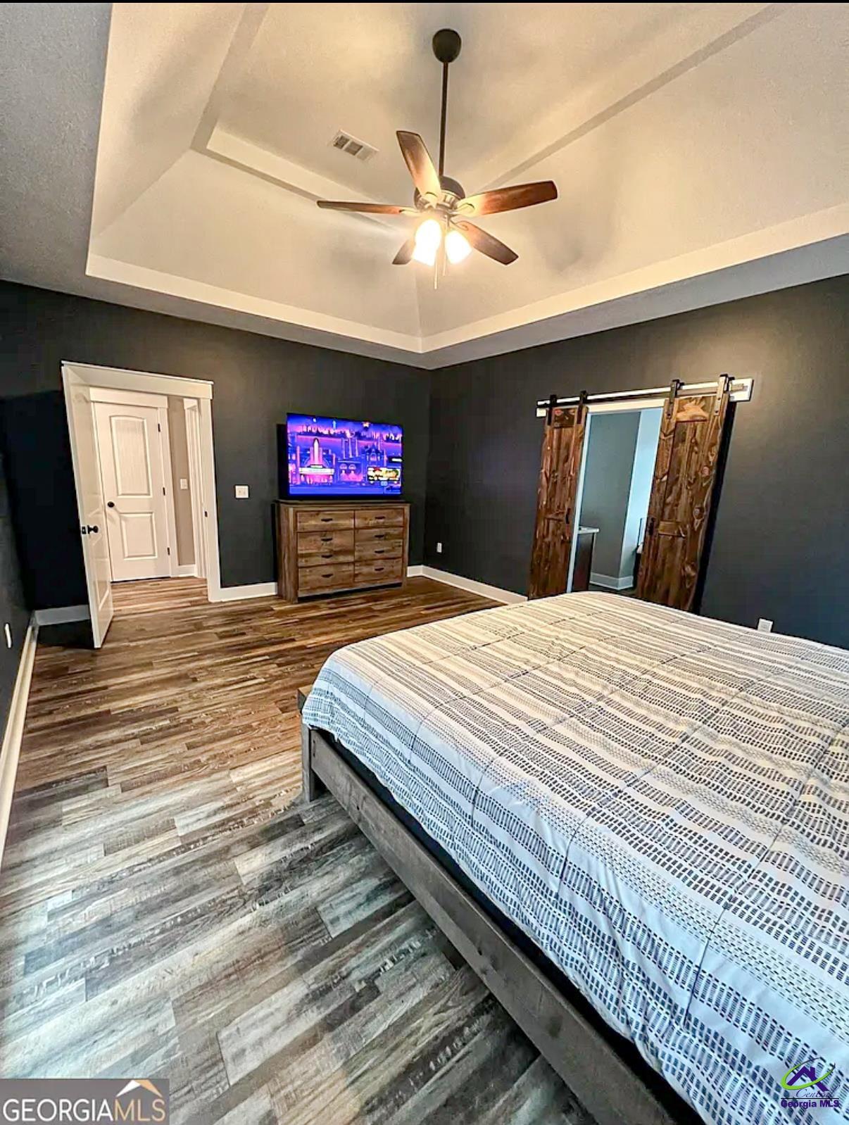 2203 Old Macon Road Montrose, GA 31065 - Photo 35 of 64 a bed sitting in a bedroom and chandelier