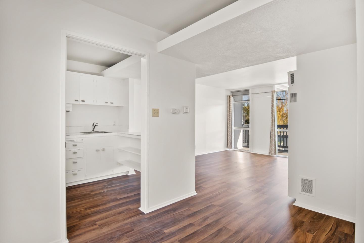 1775 Marco Polo Way Burlingame, CA 94010 - Photo 11 of 23 a view of a hallway with wooden floor