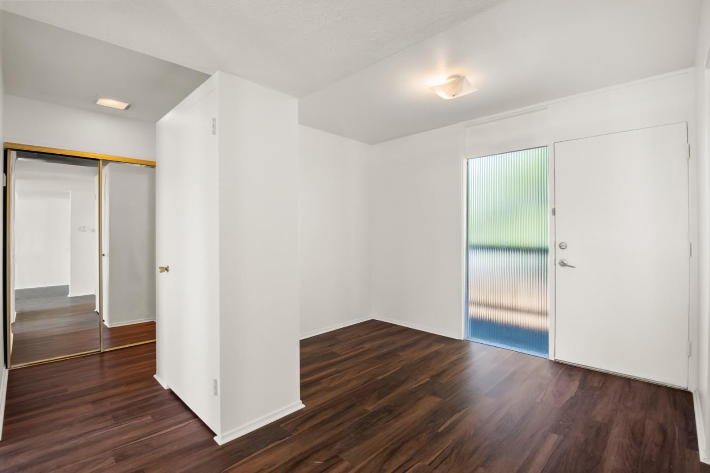 1775 Marco Polo Way Burlingame, CA 94010 - Photo 14 of 23 a view of hallway with wooden floor